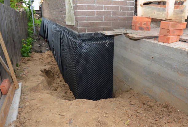 Happy homeowners after waterproofing job in Fairmount